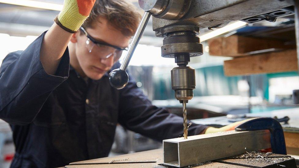 Apprentice in steel fabrication factory