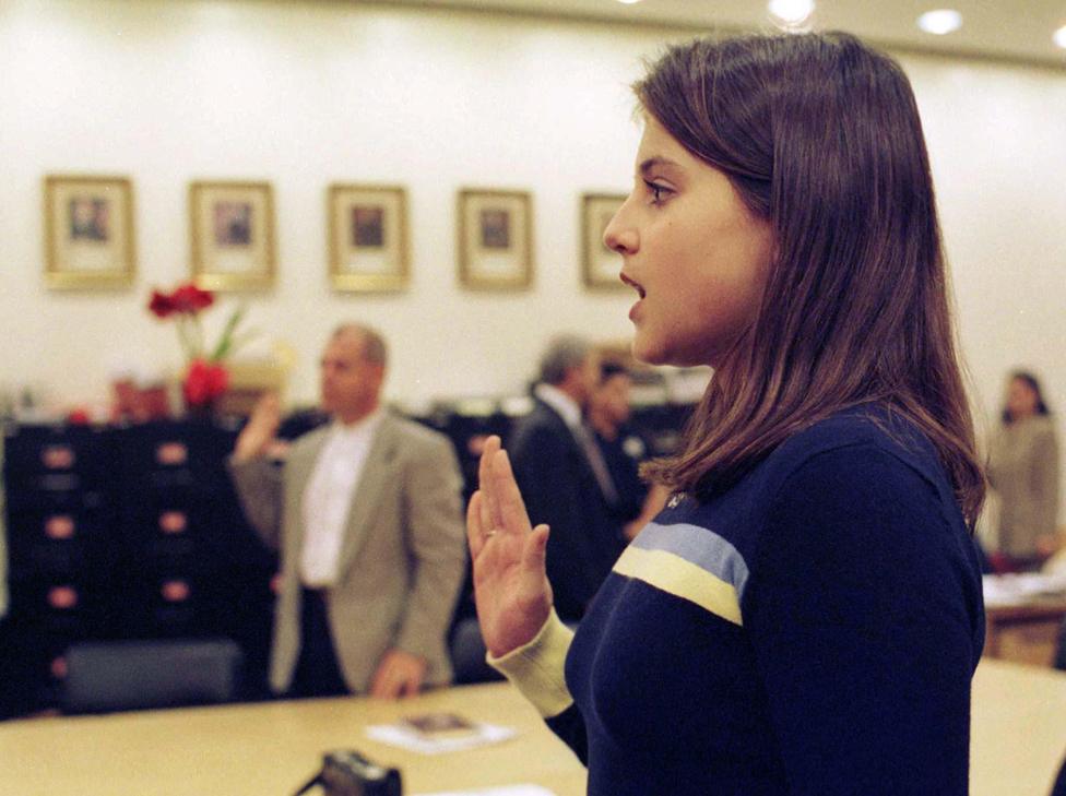 Dominique Moceanu takes an oath before a court hearing in which she is seeking a permanent protective order from her father - 9 Dec 1998