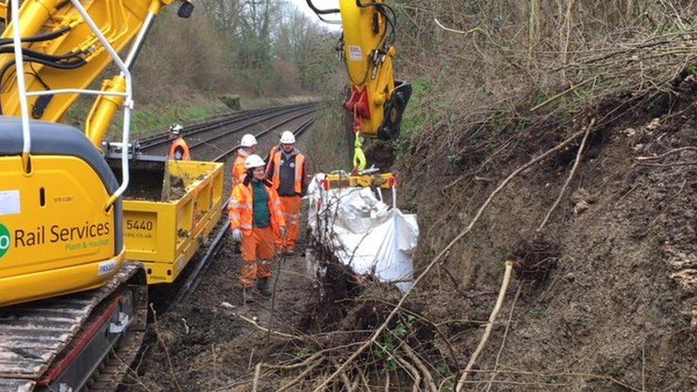 Network Rail staff working to clear the track