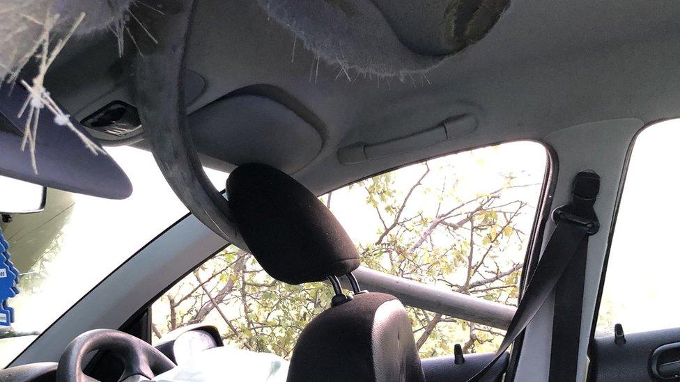 Pole through inside of car