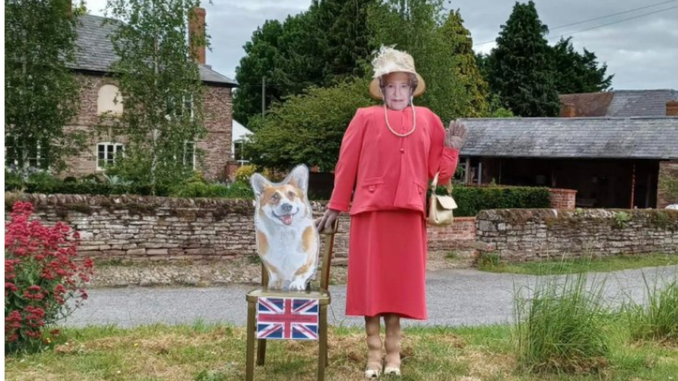 Queen and Corgi scarecrow