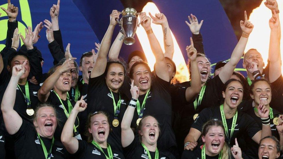 New Zealand players hold the trophy