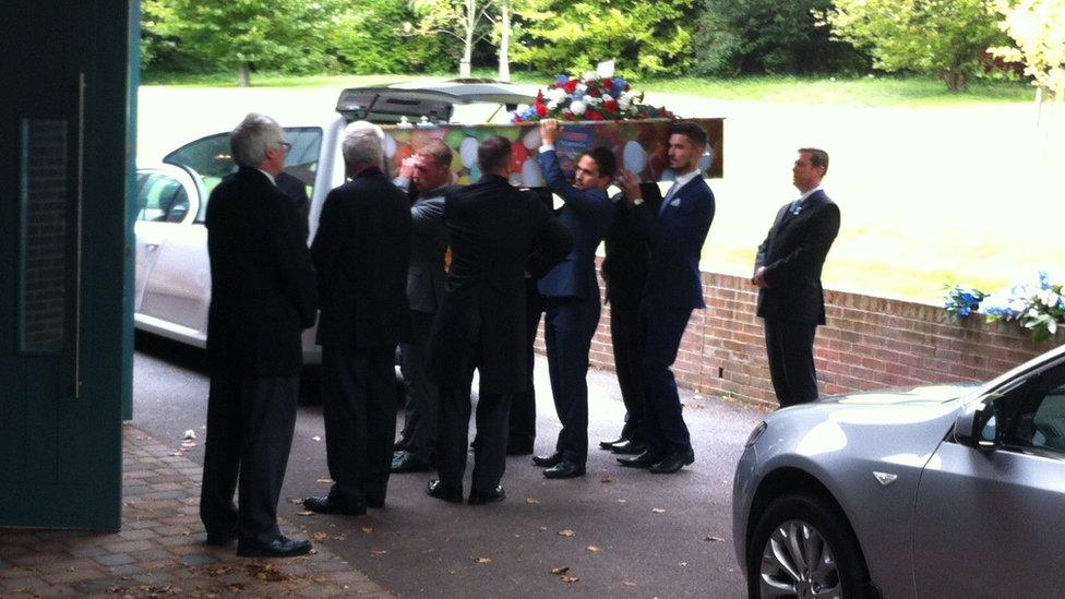 Daniele Polito's coffin is carried into Worthing Crematorium