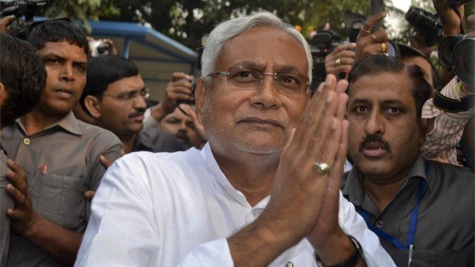 Bihar Chief Minister Nitish Kumar greets supporters after victory in Bihar state elections in Patna, India, Sunday, Nov. 8, 2015.