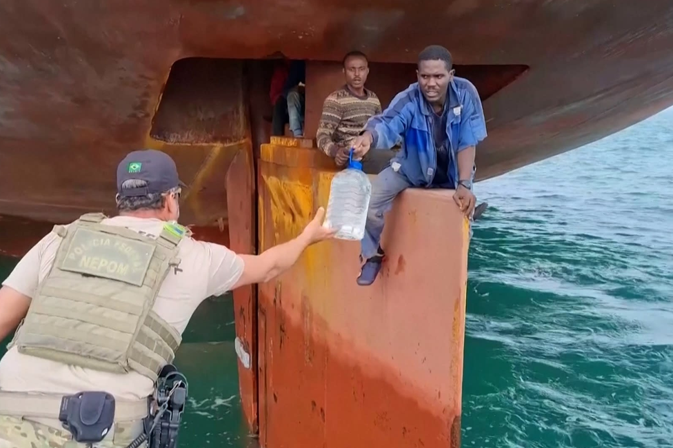 Roman Friday accepts water, perched on the rudder the took them to Brazil.