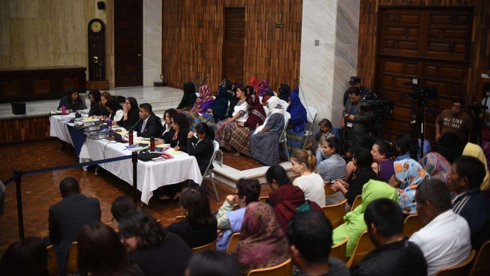 A group indigenous women covering their faces attend the trial of two army officers accused of keeping 11 indigenous women as sex slaves during the country's bloody 36-year civil war, in Guatemala City on February 1, 2016.