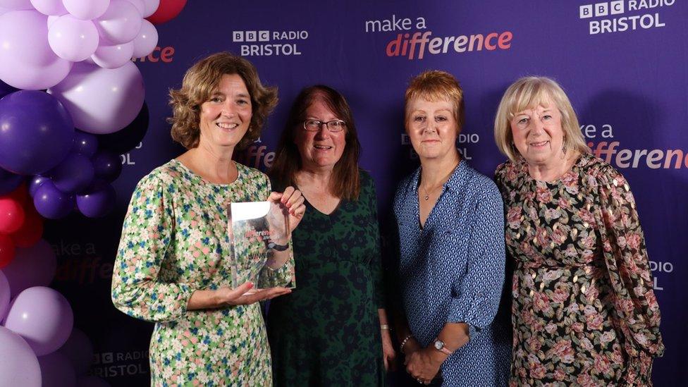 Green Award winner Laura Murgatroyd with volunteers of the Patchwork Community Gardening Group which she leads