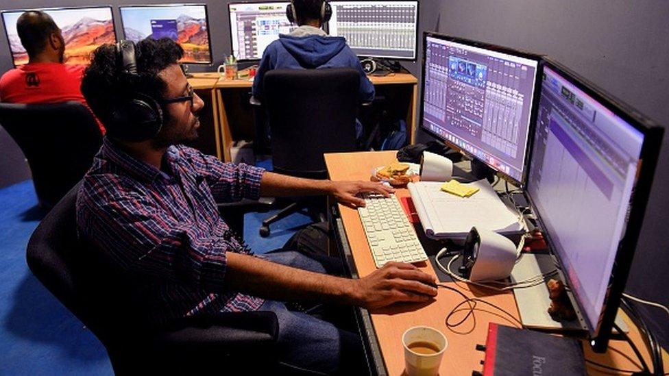 In this photo taken on January 10, 2019, employees of education technology start-up BYJU's work on content development for the app at their office in Bangalore