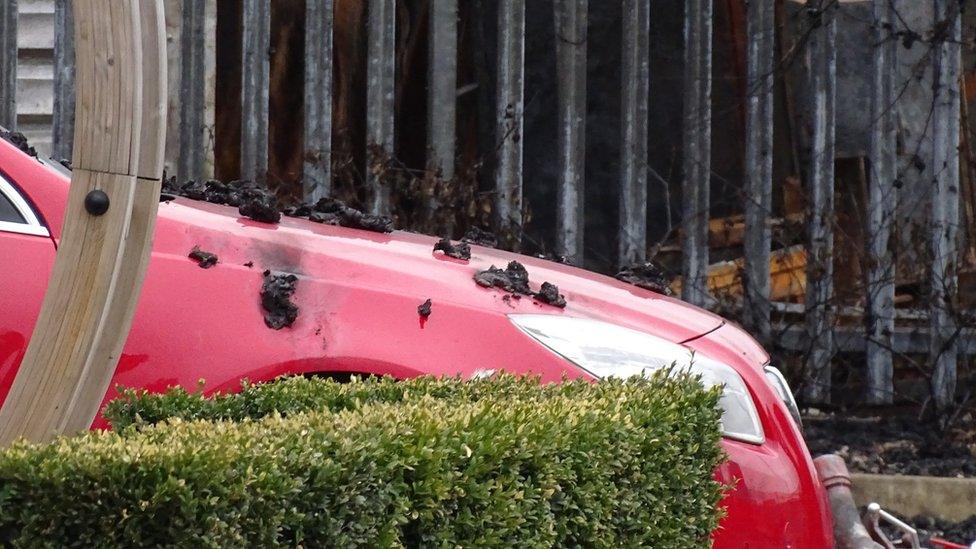 Charred debris on a car