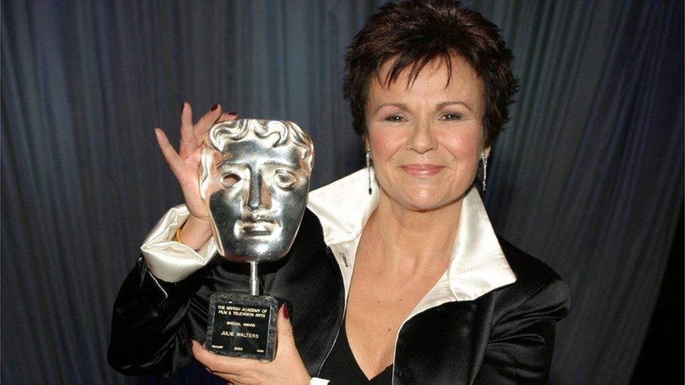 Dame Julie Walters holds a special Bafta award