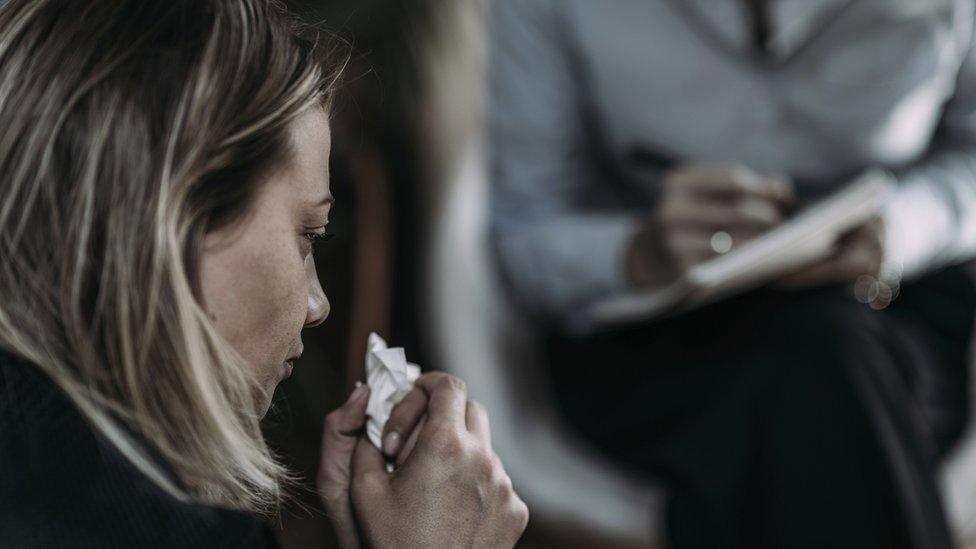 woman talking to therapist