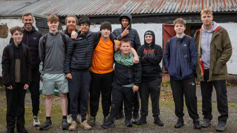 Kyle Hogg, Freddie Flintoff with the Manchester boys. Presley is in the middle of the group of 11