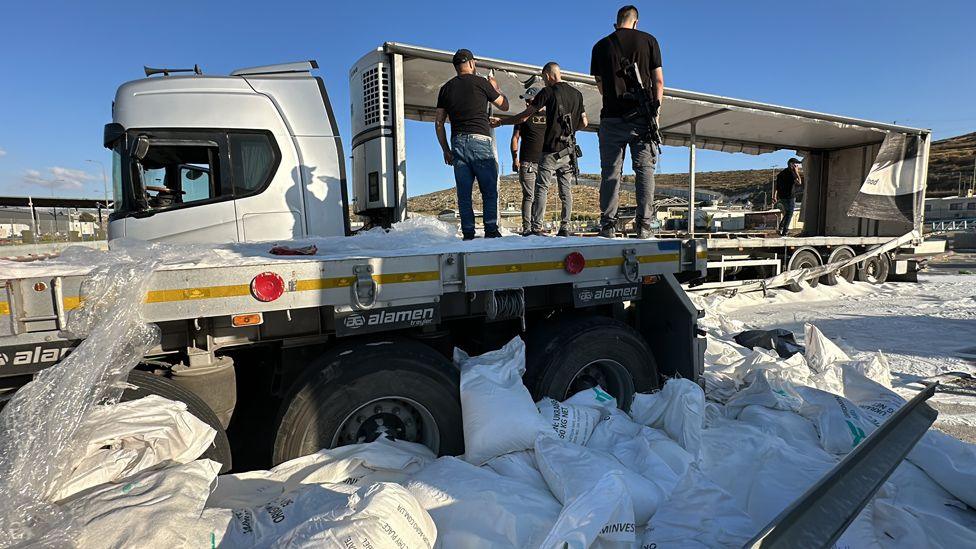 Humanitarian aid supplies dumped by Jewish settlers near Tarqumiyah military checkpoint in Hebron, West Bank