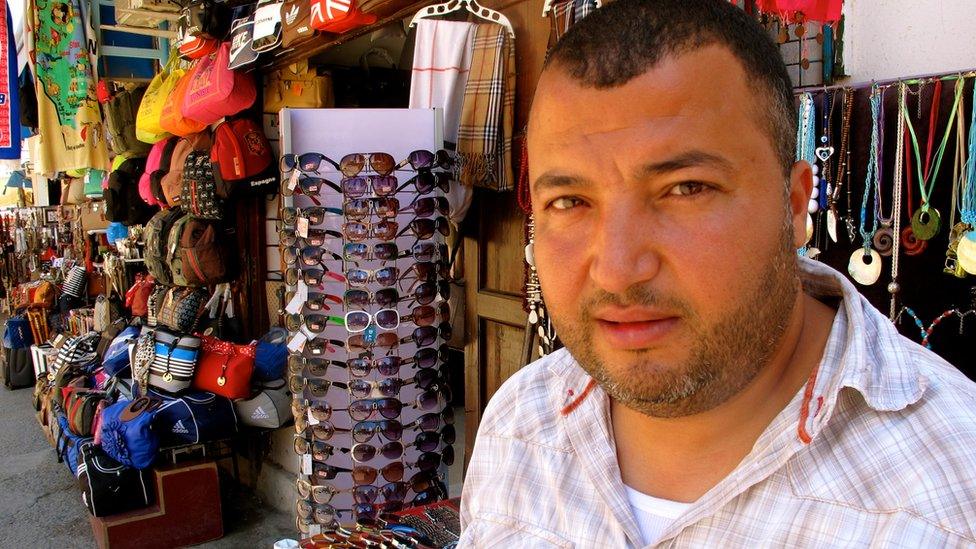 Shopkeeper Naoufel Barhoumi's business fallen off sharply in the wake of the attacks