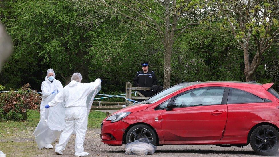 Forensics investigate in the car park where the fatal collision took place