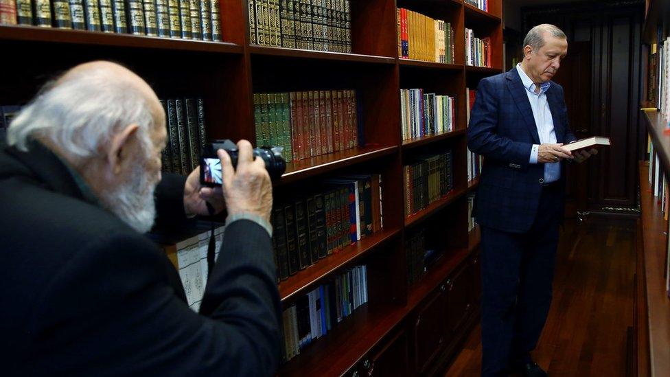 Ara Guler takes a photo of President Recep Tayyip Erdogan at Erdogan's study room in Istanbul, Turkey