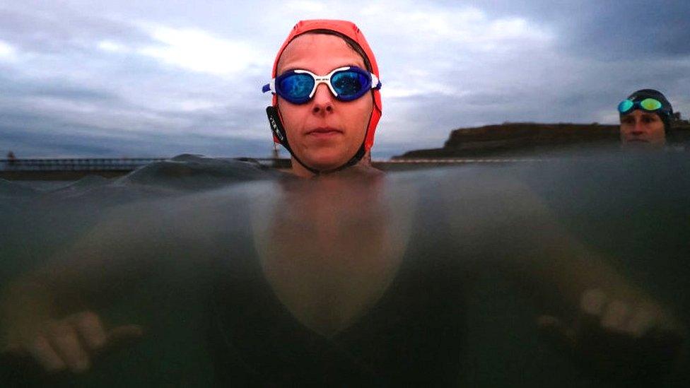 Woman swimming in sea