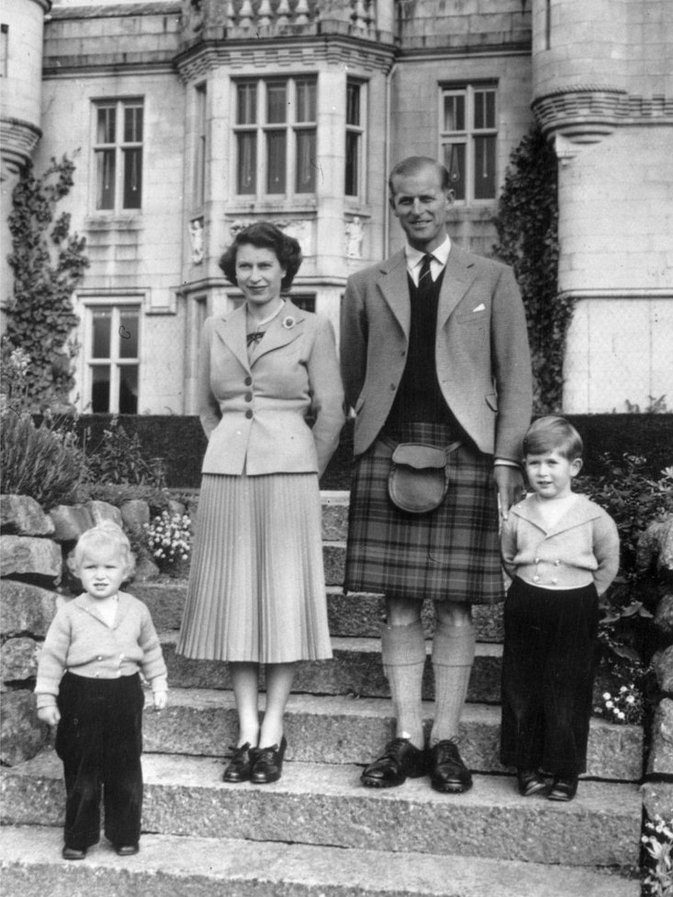 19th September 1952: Queen Elizabeth II and The Prince Philip, Duke of Edinburgh with their two young children, Princess Anne and Prince Charles outside Balmoral Castle