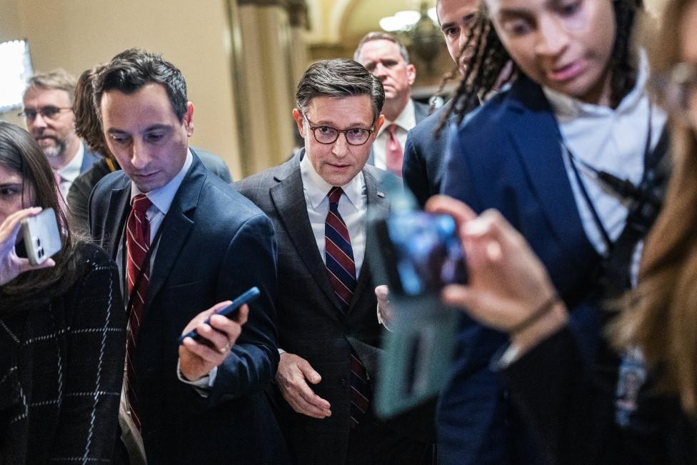 Republican House Speaker Mike Johnson (centre)