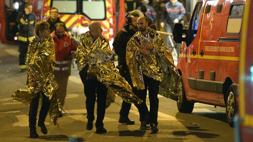 People being evacuated near the Bataclan concert hall