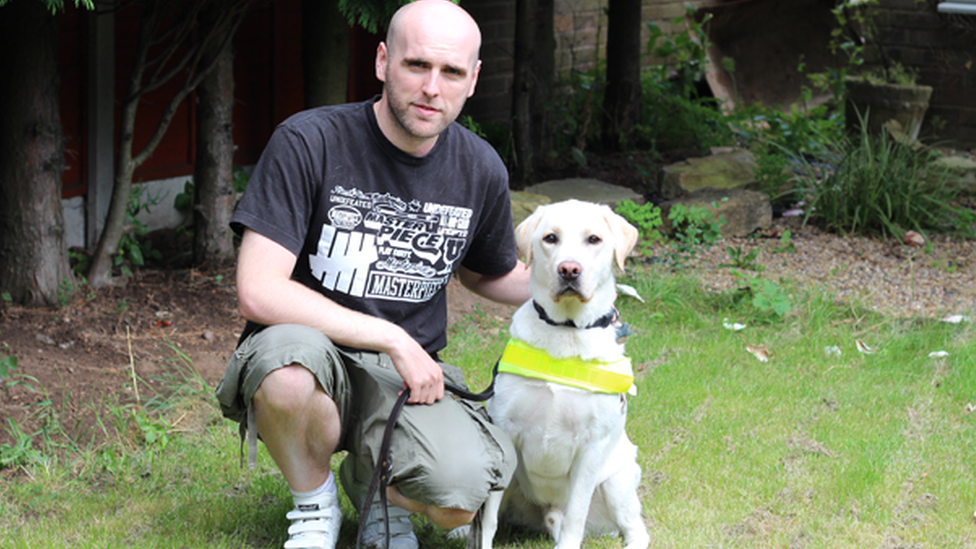 Simon Wheatcroft and Ascot guide dog