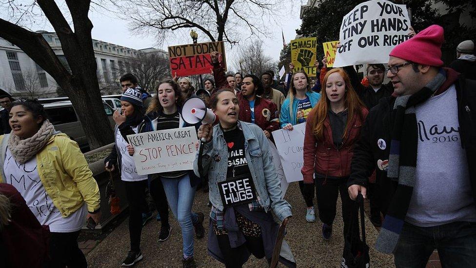 Demonstrators protest against US President-elect Donald Trump in Washington.