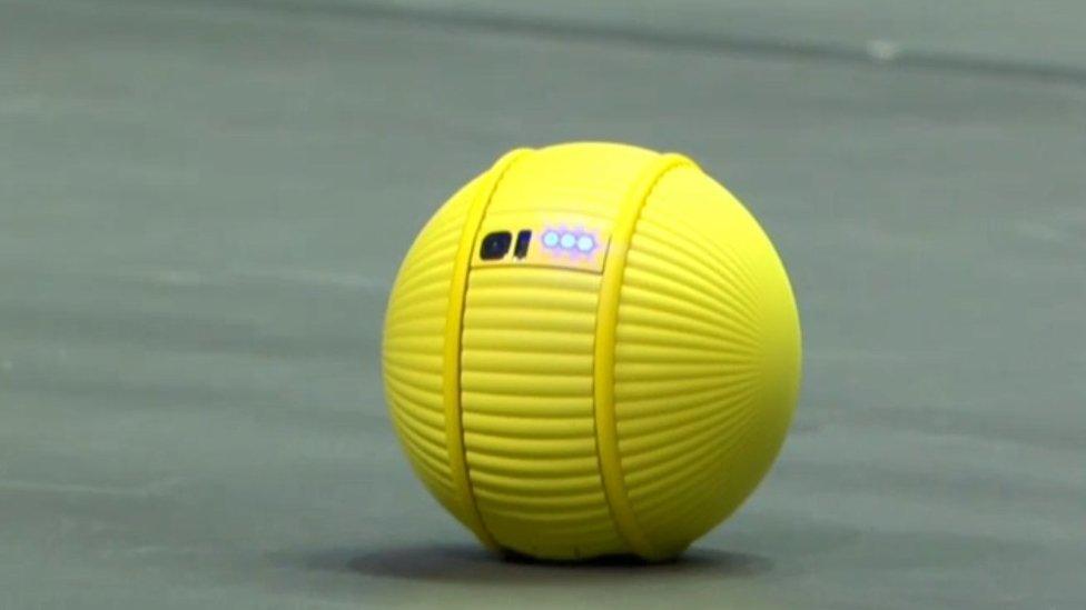 The yellow, ball-shaped robot Ballie on stage at CES