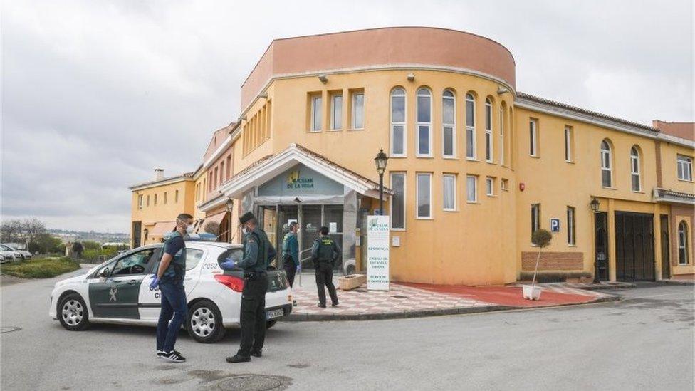 Civil Guard officers outside a nursing home for elderly people in Cajar, southern Spain, 26 March 2020.