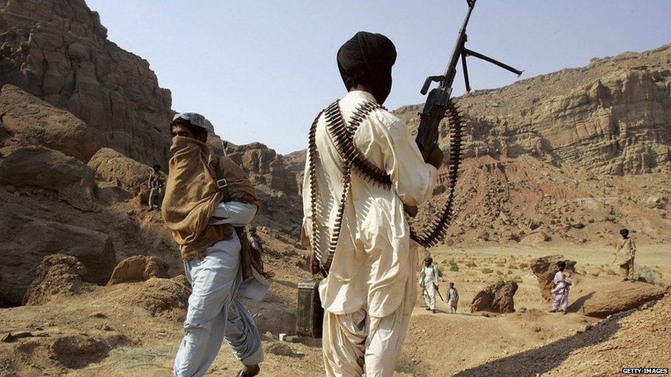 Bugti guerrilla stands guard at a remote camp outside of Dera Bugti, in the province of Balochistan, Pakistan on January 22, 2006.