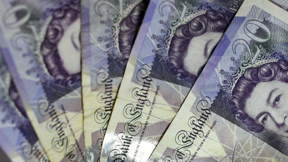 A photograph of £20 notes fanned out