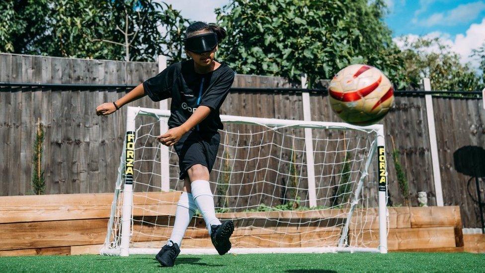 Mikey playing football