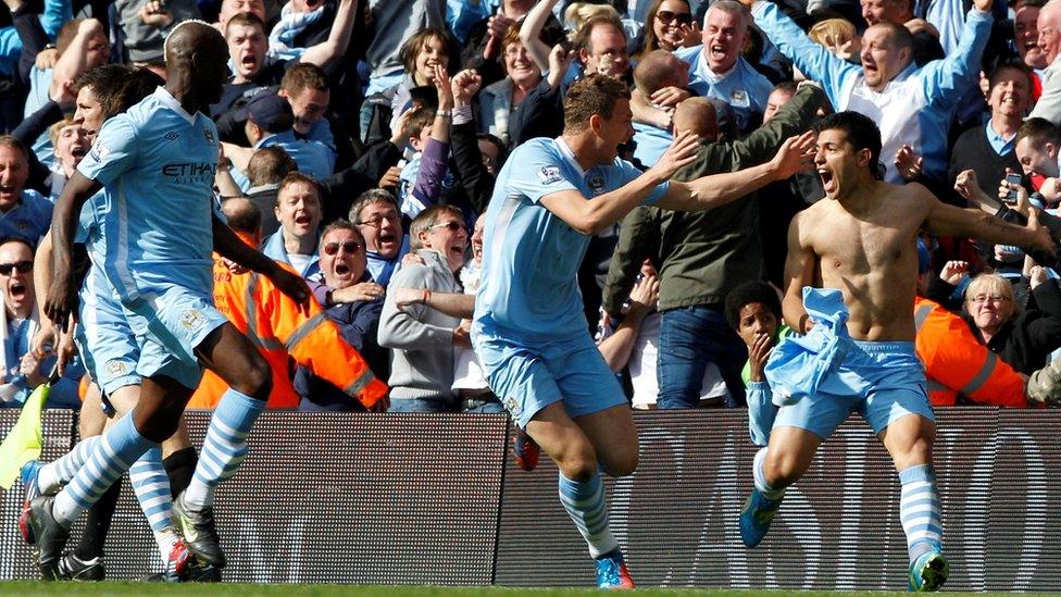 Manchester City's Sergio Aguero (right) celebrates his winning goal with team mates Mario Balotelli (left) and Edin Dzeko (centre)