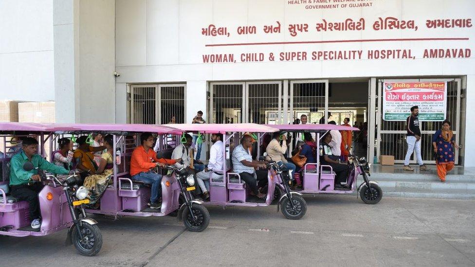 e-rickshaws parked outside a Gujarat hospital