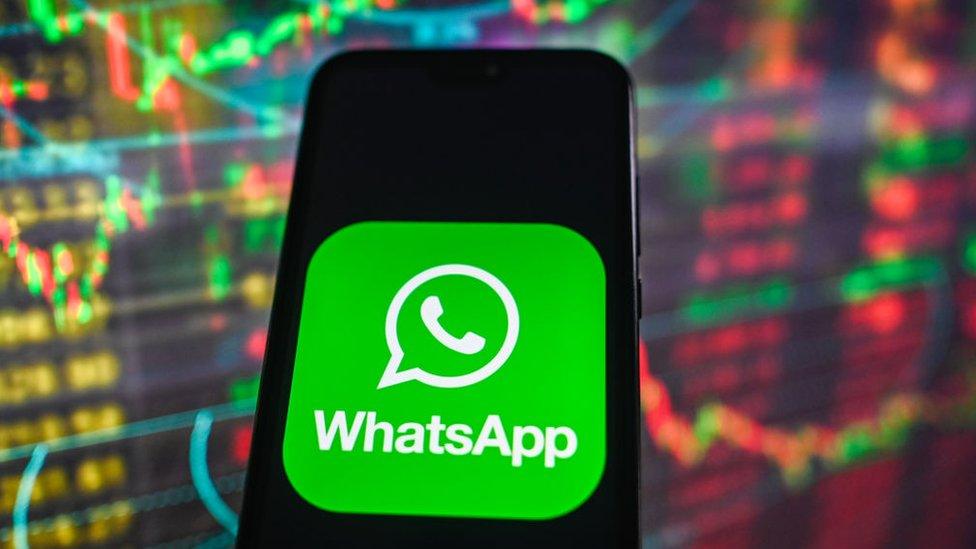 WhatsApp logo on phone