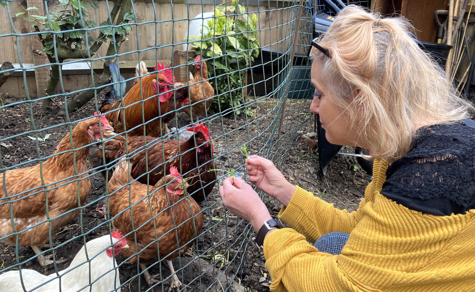 Julie Smith with her hens and cockerel