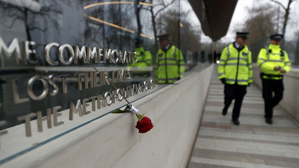 A floral tribute is seen outside New Scotland Yard following a recent attack in Westminster, in London, Britain.