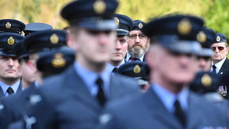 Servicemen attending funeral