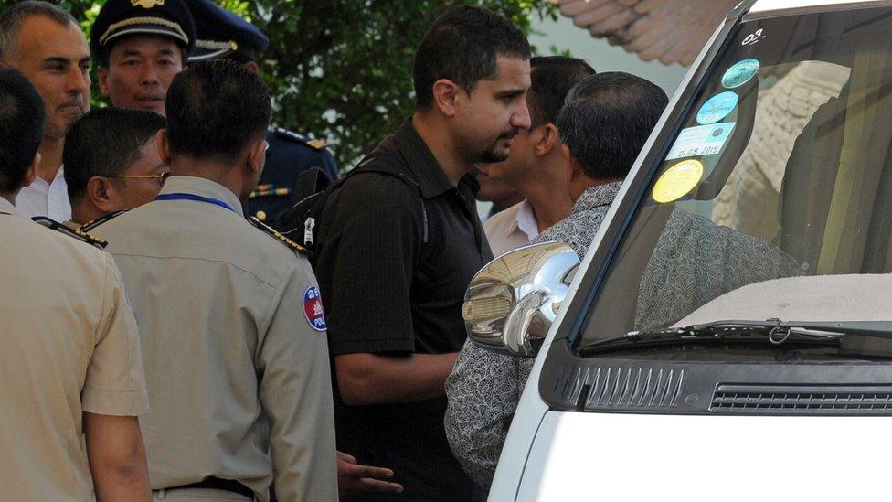 One of the original four refugees who settled in Cambodia is seen arriving at Phnom Penh international airport