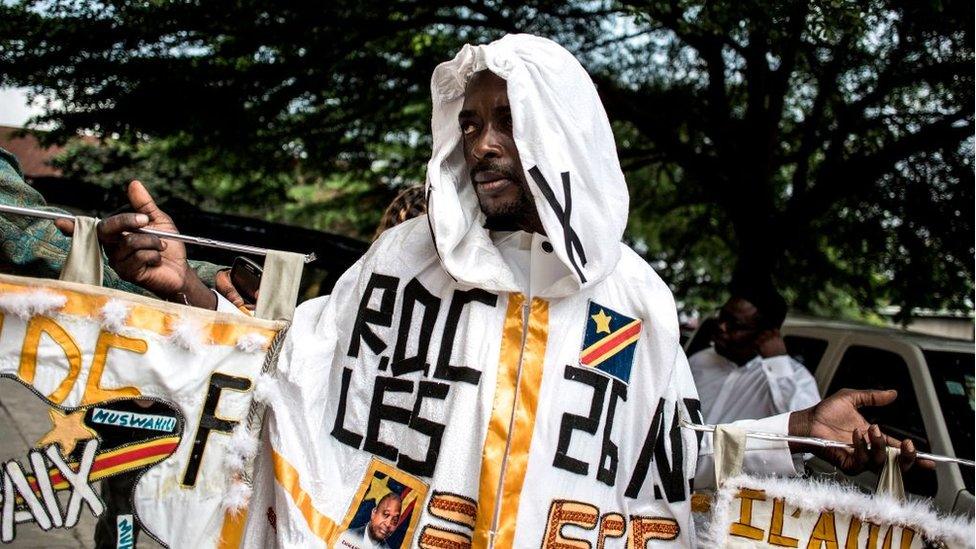 A supporter of DRCongo Official Presidential candidate, Emmanuel Ramazani Shadary poses in Kinshasa on November 24, 2018