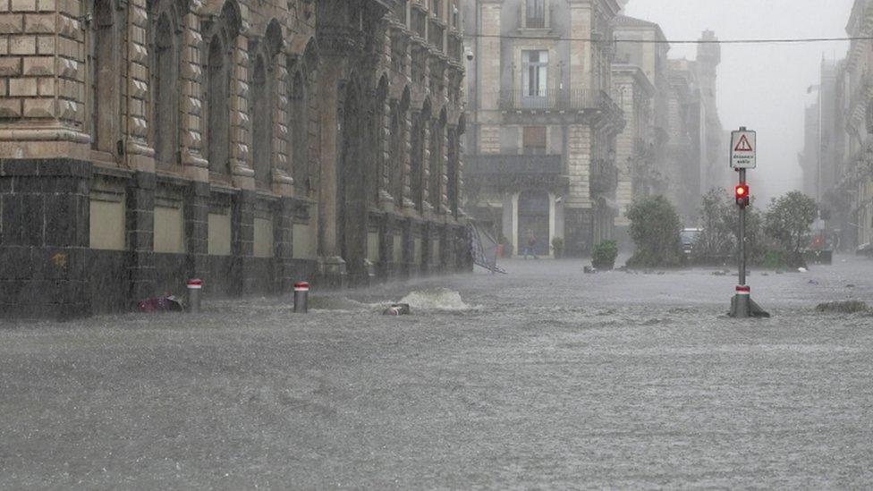 Streets are flooded during heavy rainfall on the island of Sicily, in Catania