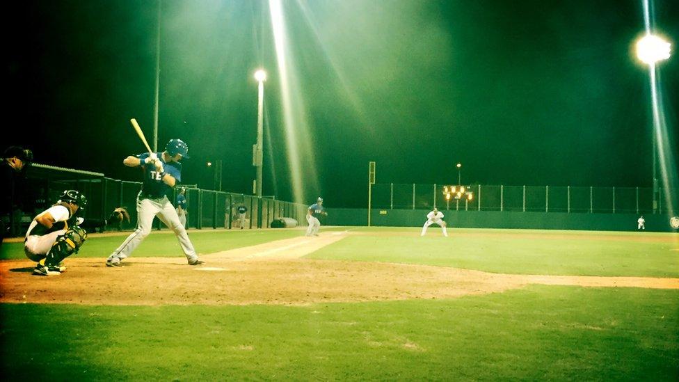 The Rangers are at bat against the A's in Mesa, Arizona.