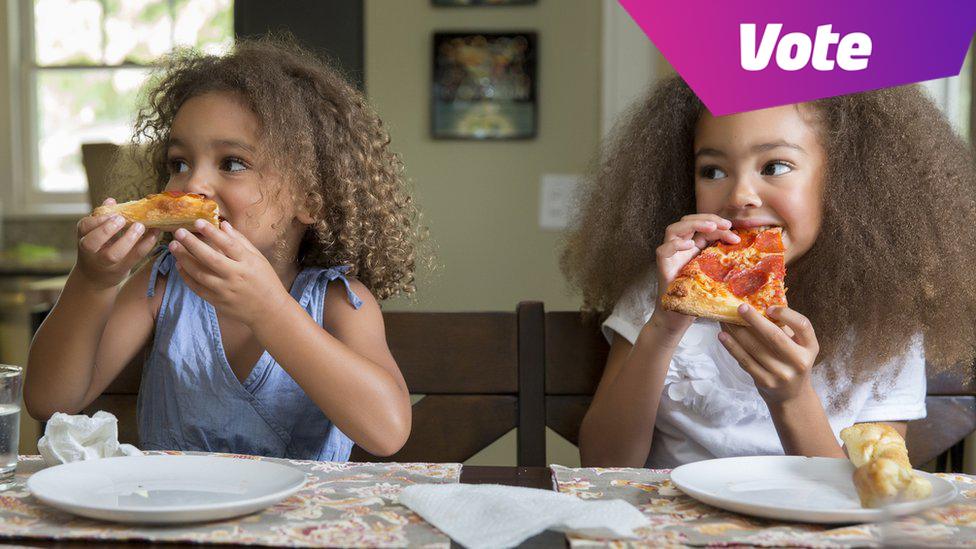 Girls eating pizza.