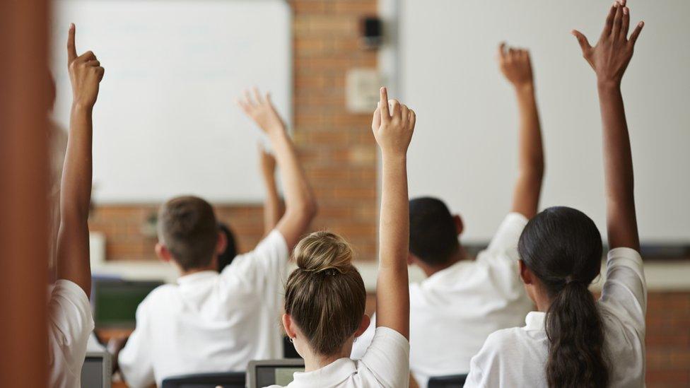 Young teenagers in a school classroom