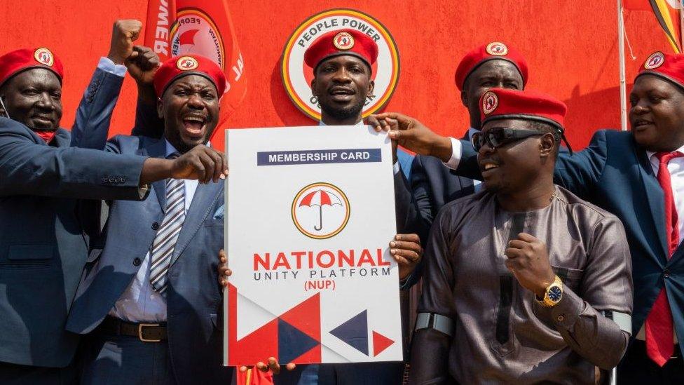 Ugandan singer turned politician Robert Kyagulanyi (C) aka Bobi Wine announces the membership of his new political party called National Unity Platform (NUP)