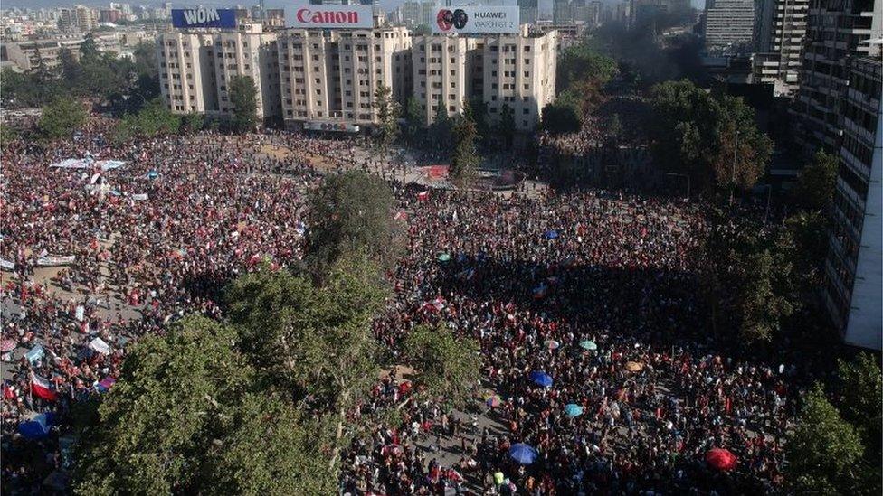 Aerial view as demonstrators march during a national strike and general demonstration called by different workers unions on November 12, 2019 in Santiago, Chile