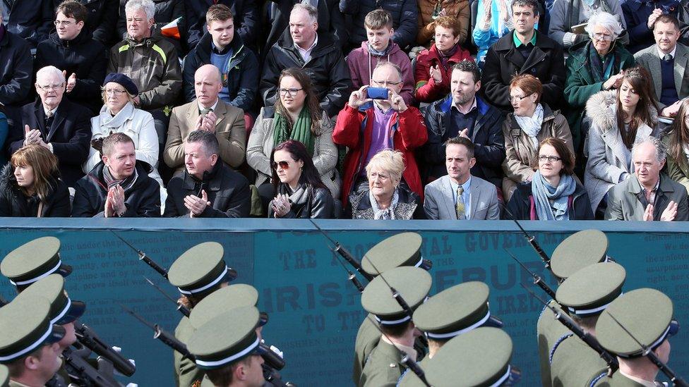 Members of the public watch the parade in Dublin commemorating 100 years since the Easter Rising