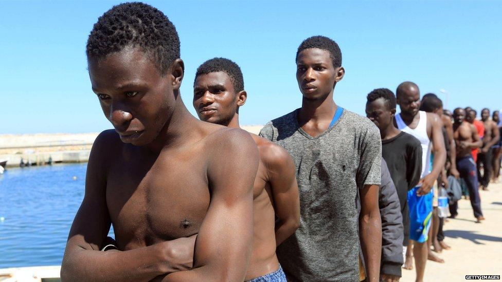 Illegal immigrants from Africa, lined up on the way to a detention centre in Libya