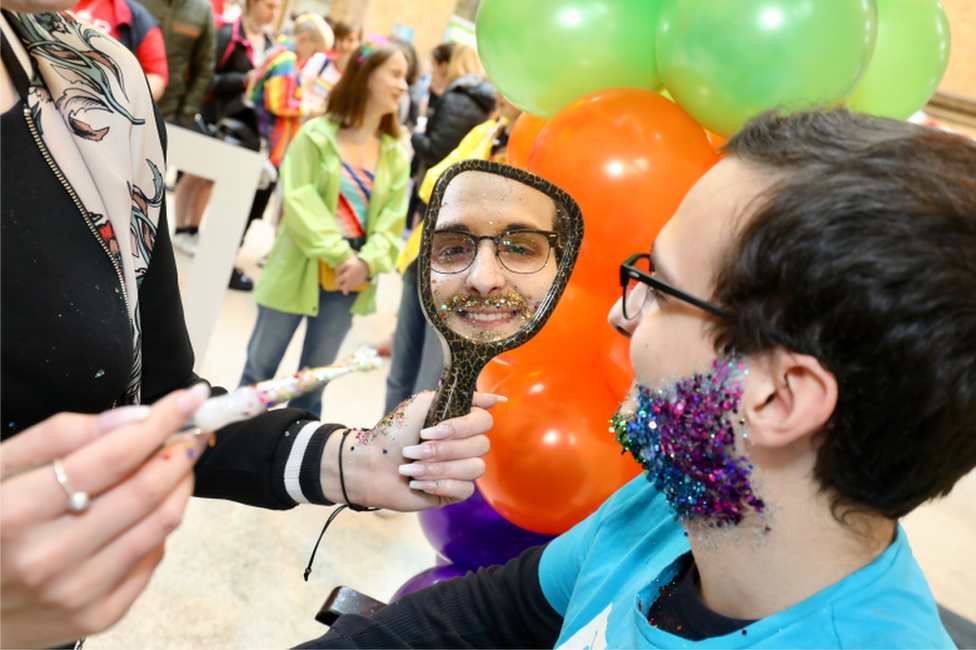 Person with glitter around their face