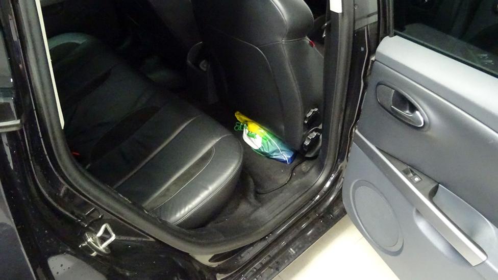 Picture taken by an MI5 officer of a bag inside Naweed Ali's car, packed under the driver's seat, in which investigators found a cleaver, replica gun and pipe bomb during a search in August 2016