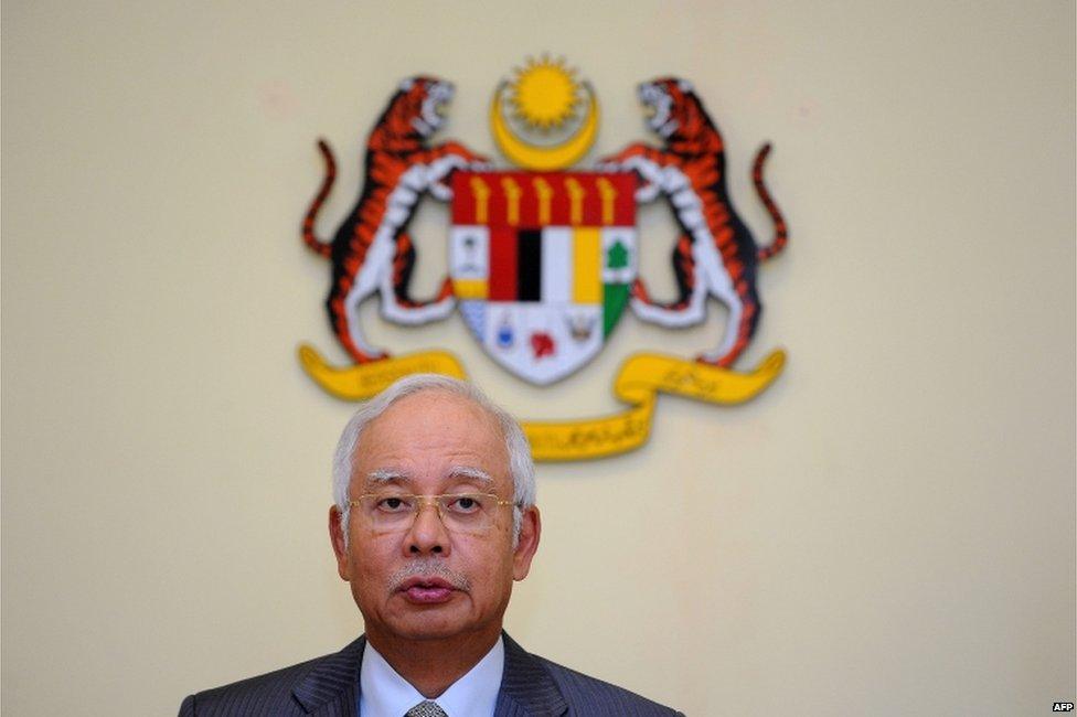 This file picture taken on 28 July 2015 shows Malaysia's Prime Minister Najib Razak addressing a press conference at his office in Putrajaya.